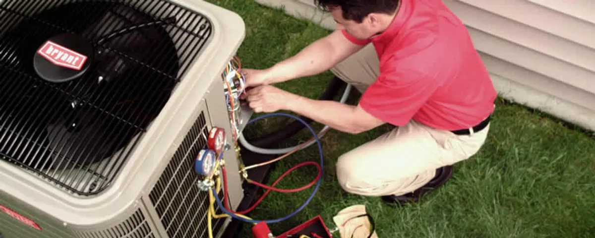 HVAC technician servicing an outdoor air conditioner unit in Chandler, AZ